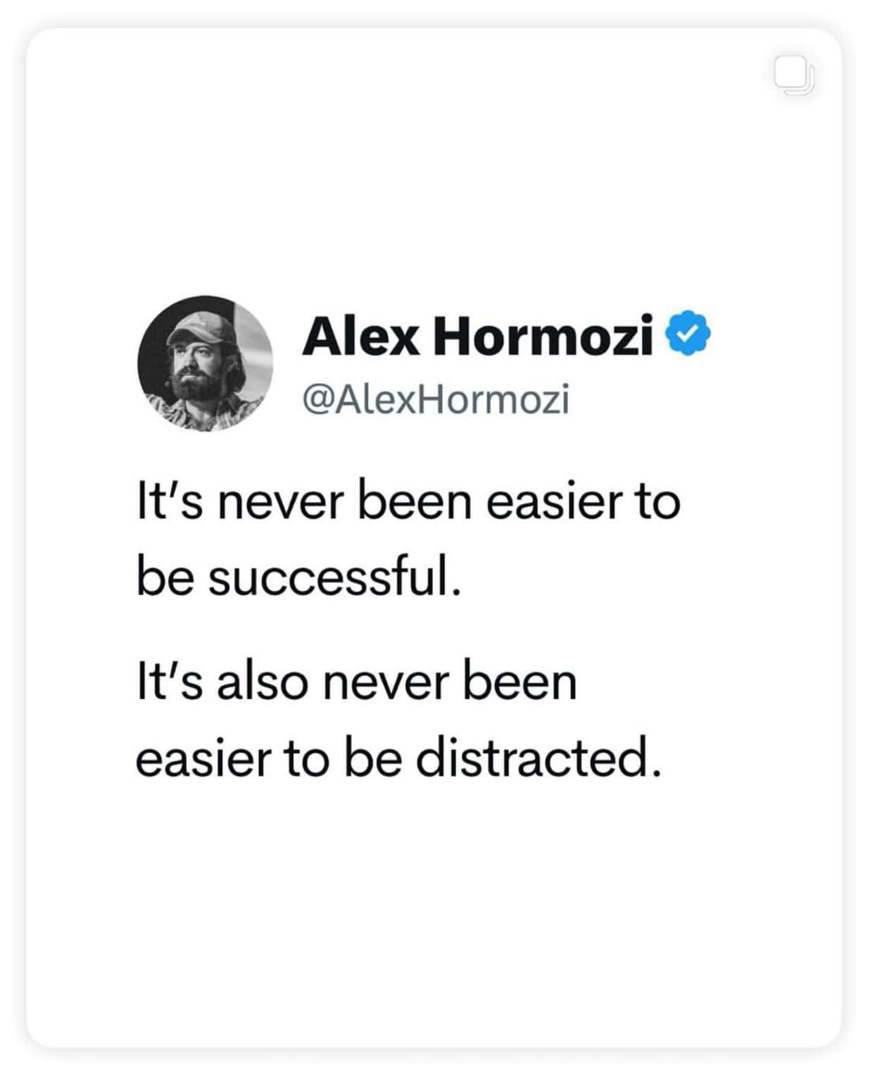 A minimalist Twitter-style quote post featuring Alex Hormozi’s profile picture and verified badge, with his handle @AlexHormozi. The text reads: “It’s never been easier to be successful. It’s also never been easier to be distracted.” White background, black text, simple and clean design, rounded card edges.